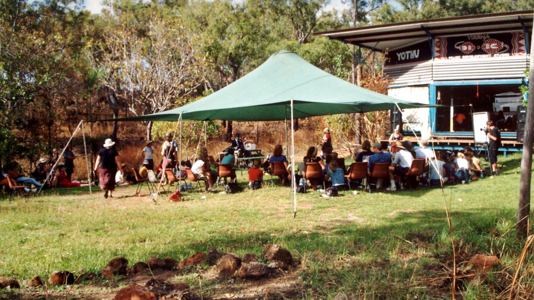 Inaugural Symposium on Indigenous Music and Dance being held outdoors, Gunyaŋara 2002